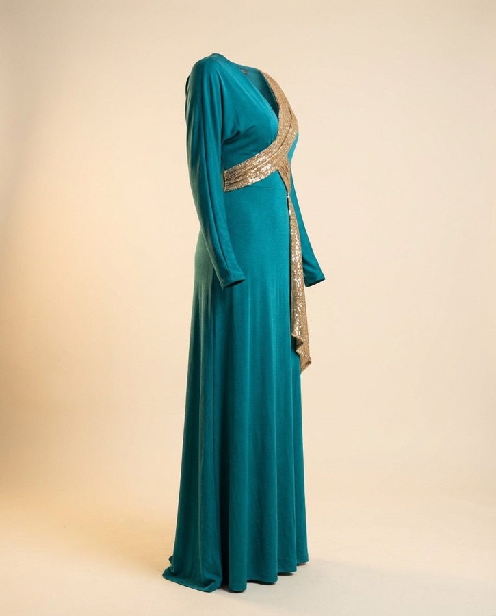 Caliente by Oscar B — teal gown with gold crystal sash